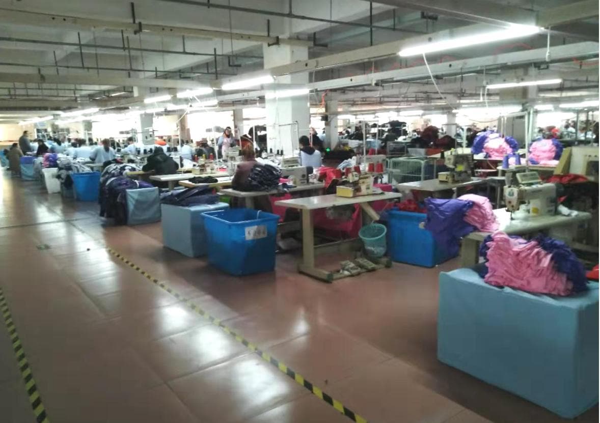 PartyTime garment production workshop with sewing lines and active workstations
