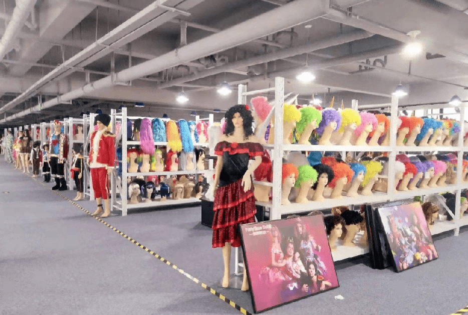 Wide PartyTime costume and wig showroom archive with reference samples displayed by category